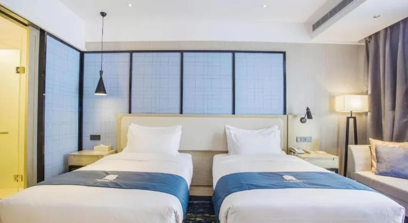 Bed in Echarm Hotel Xinyu Railway Station Baoshi Park