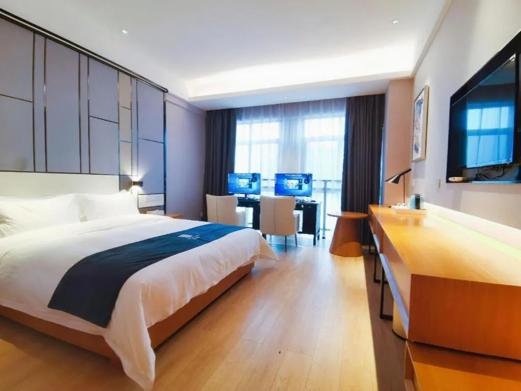 Bed in Echarm Hotel Xinyu Railway Station Baoshi Park