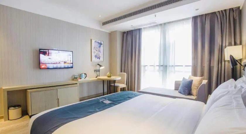 Bed in Echarm Hotel Xinyu Railway Station Baoshi Park