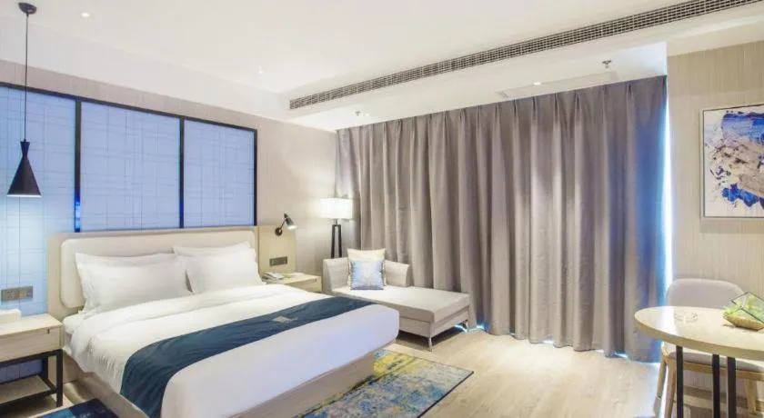 Bed in Echarm Hotel Xinyu Railway Station Baoshi Park