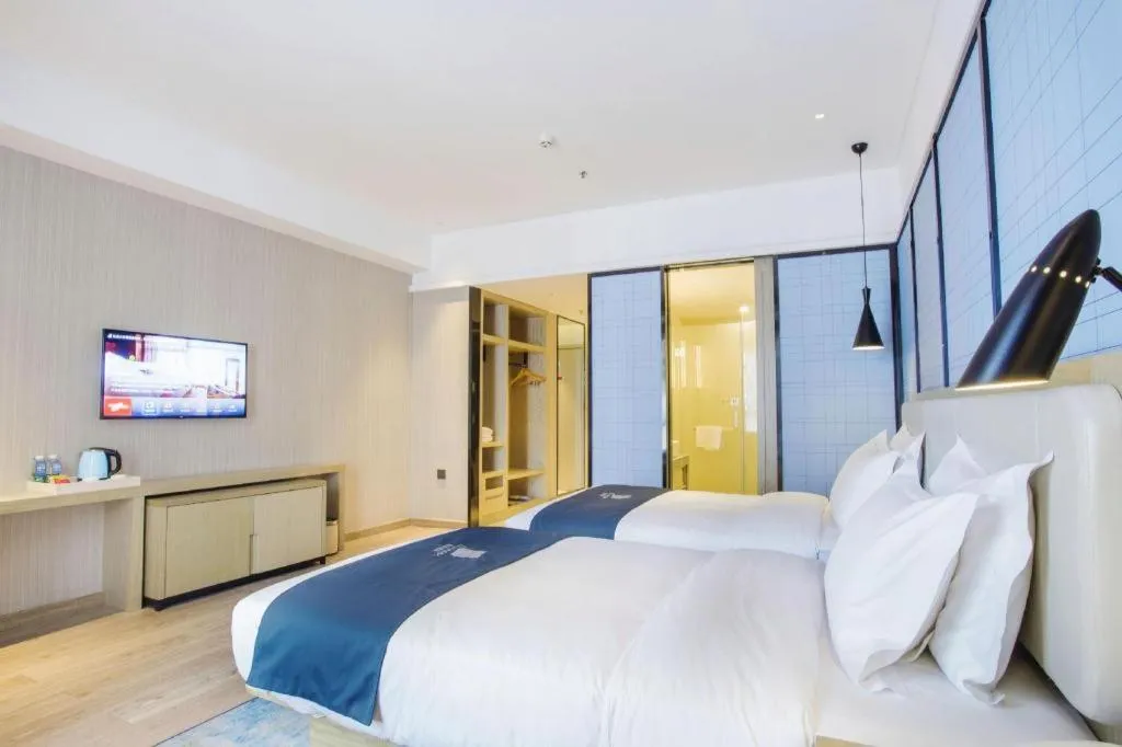 Bed in Echarm Hotel Xinyu Railway Station Baoshi Park