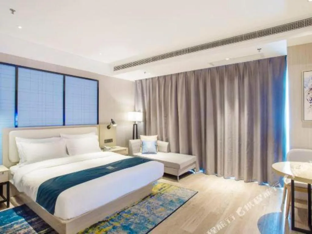 Bed in Echarm Hotel Xinyu Railway Station Baoshi Park