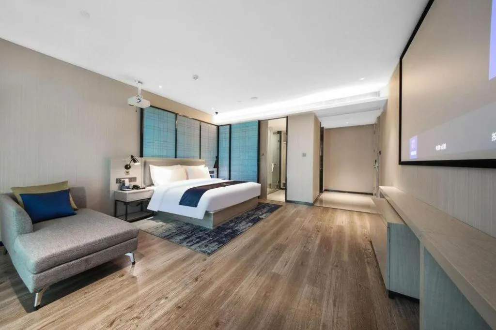 Bed in Echarm Hotel Xinyu Railway Station Baoshi Park