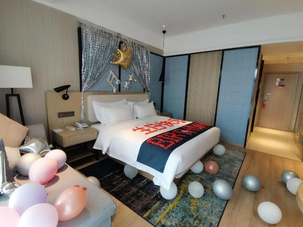 Bed in Echarm Hotel Xinyu Railway Station Baoshi Park