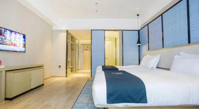 Bed in Echarm Hotel Xinyu Railway Station Baoshi Park