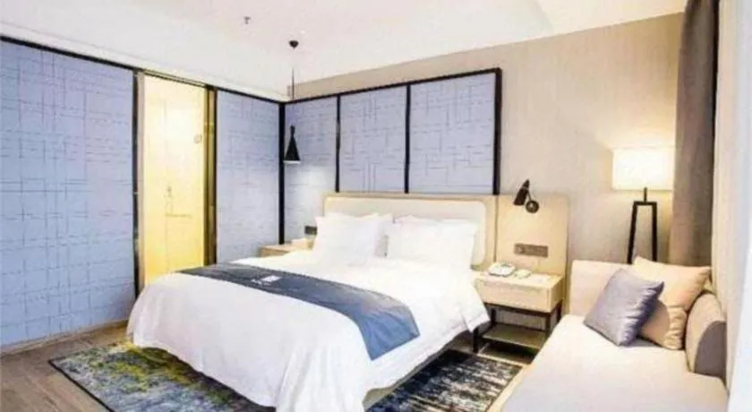 Bed in Echarm Hotel Xinyu Railway Station Baoshi Park