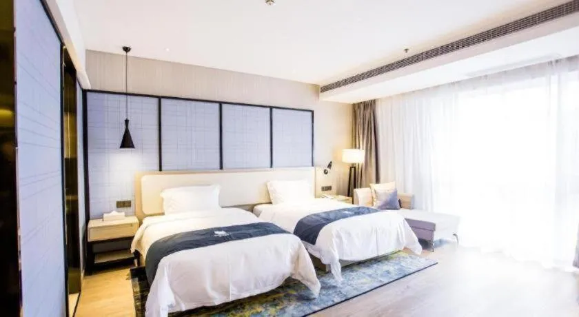 Bed in Echarm Hotel Xinyu Railway Station Baoshi Park