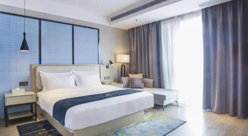 Bed in Echarm Hotel Xinyu Railway Station Baoshi Park