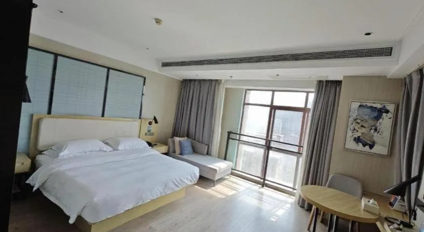 Bed in Echarm Hotel Xinyu Railway Station Baoshi Park