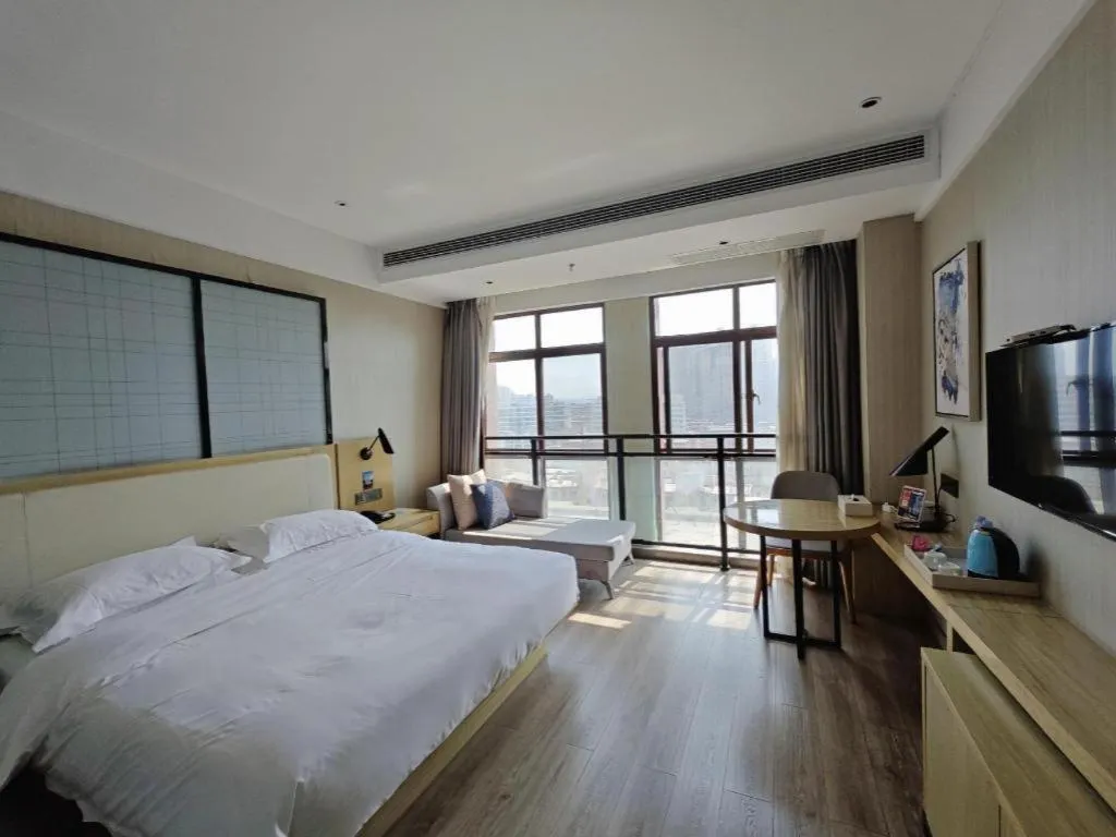 Bed in Echarm Hotel Xinyu Railway Station Baoshi Park