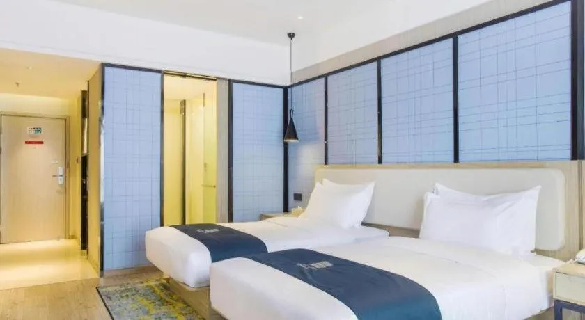 Bed in Echarm Hotel Xinyu Railway Station Baoshi Park