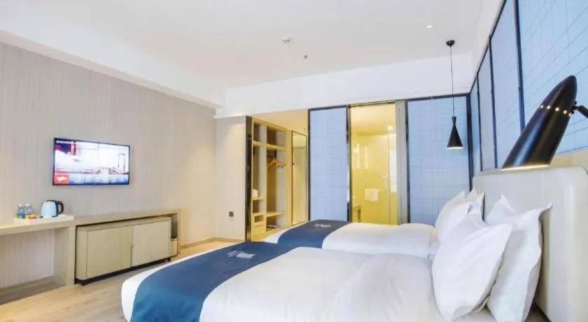 Bed in Echarm Hotel Xinyu Railway Station Baoshi Park