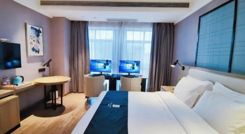 Bed in Echarm Hotel Xinyu Railway Station Baoshi Park