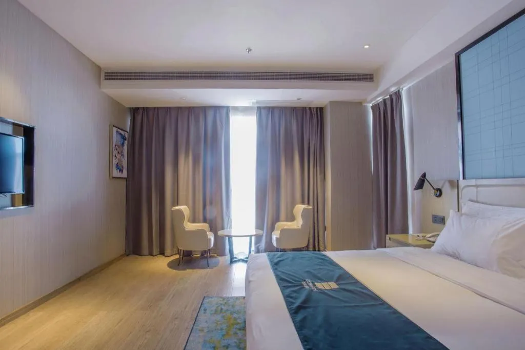 Bed in Echarm Hotel Xinyu Railway Station Baoshi Park