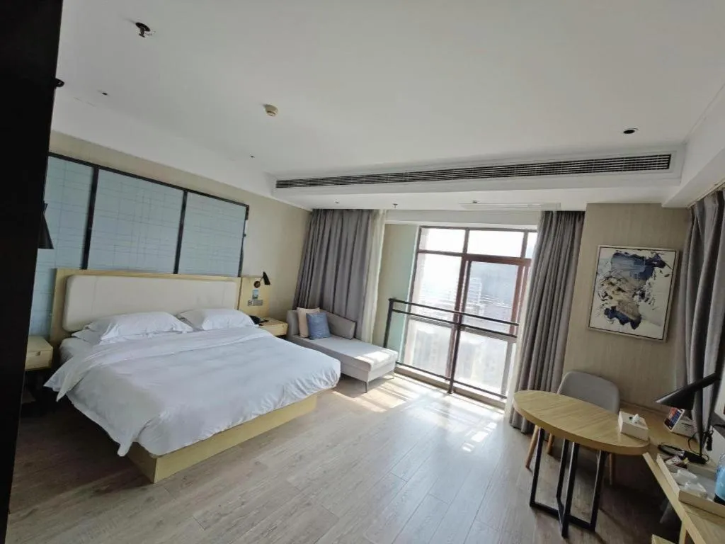 Bed in Echarm Hotel Xinyu Railway Station Baoshi Park