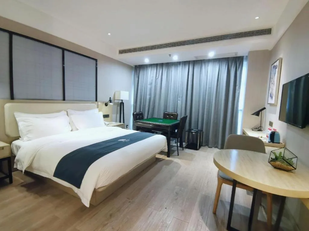 Bed in Echarm Hotel Xinyu Railway Station Baoshi Park