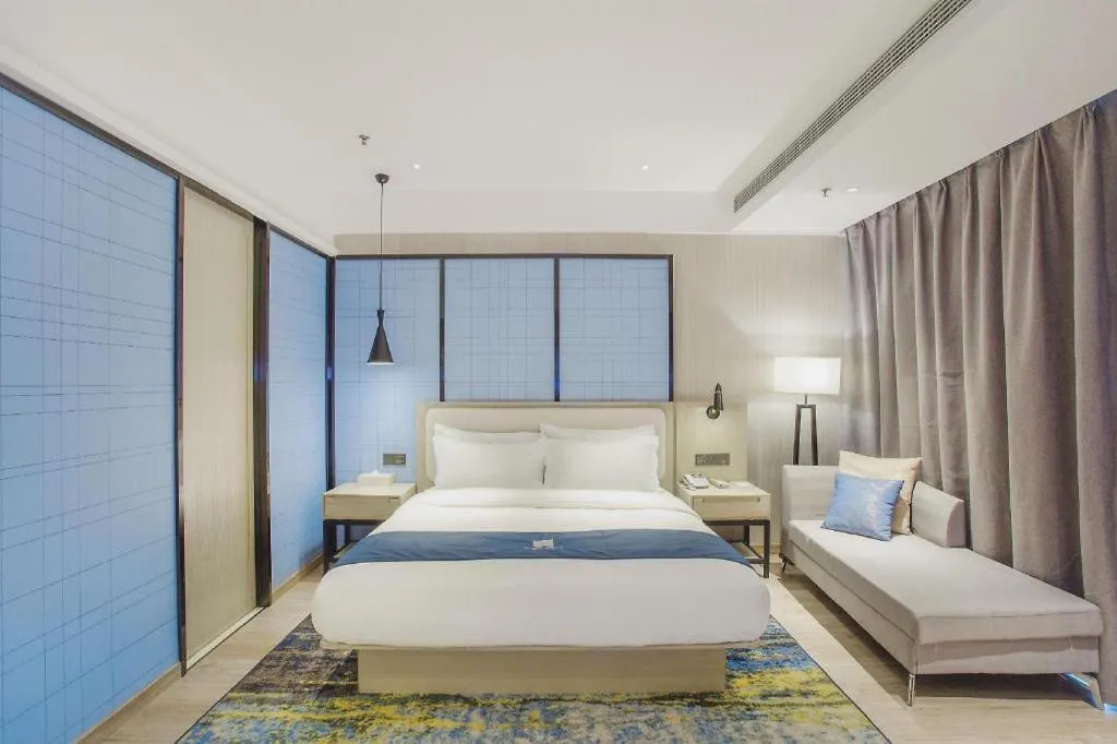 Bed in Echarm Hotel Xinyu Railway Station Baoshi Park