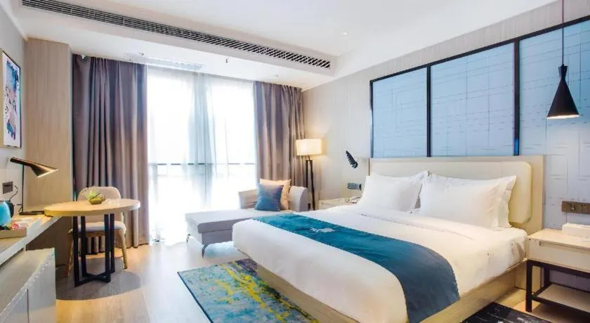 Bed in Echarm Hotel Xinyu Railway Station Baoshi Park