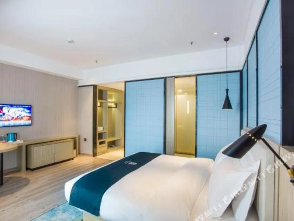 Bed in Echarm Hotel Xinyu Railway Station Baoshi Park