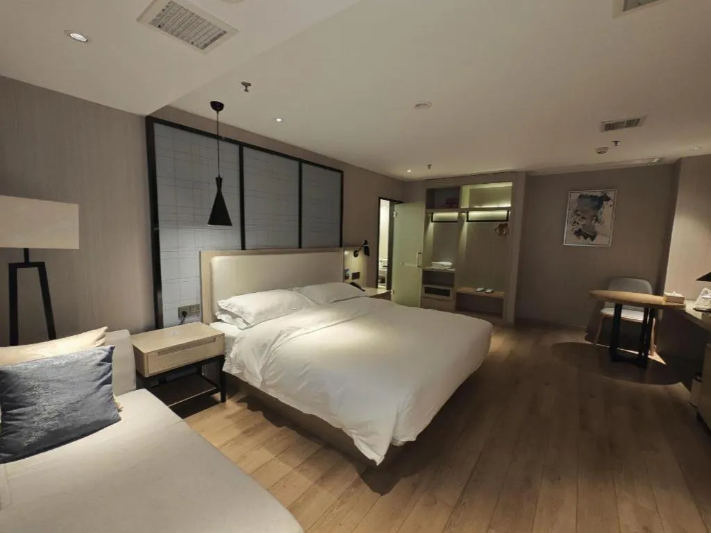 Bed in Echarm Hotel Xinyu Railway Station Baoshi Park