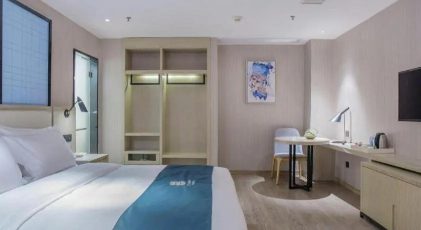 Bed in Echarm Hotel Xinyu Railway Station Baoshi Park