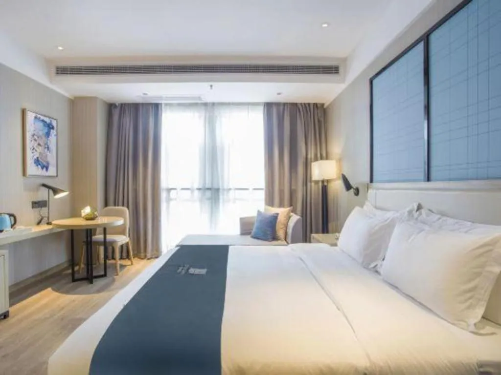 Bed in Echarm Hotel Xinyu Railway Station Baoshi Park