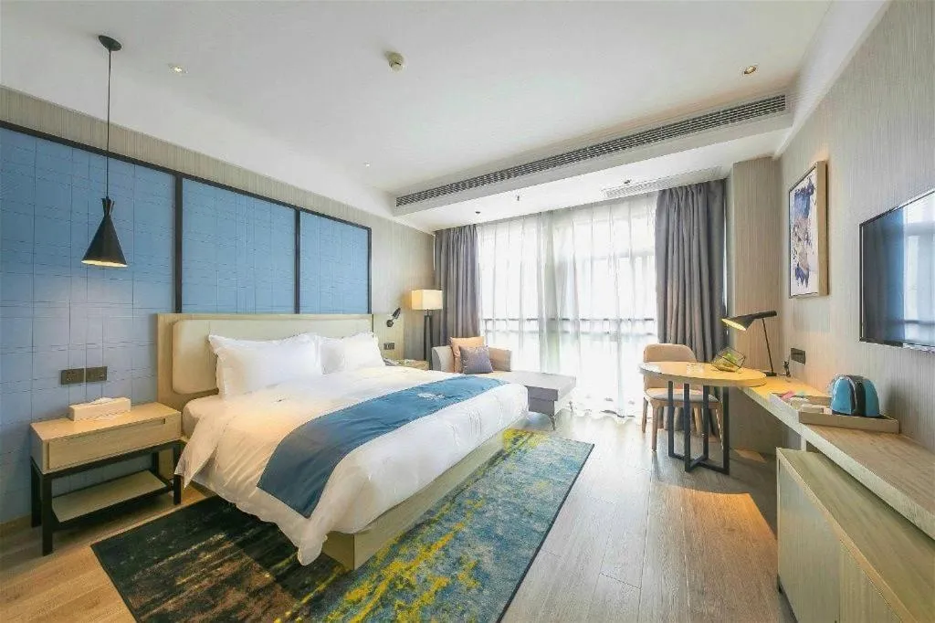 Bed in Echarm Hotel Xinyu Railway Station Baoshi Park