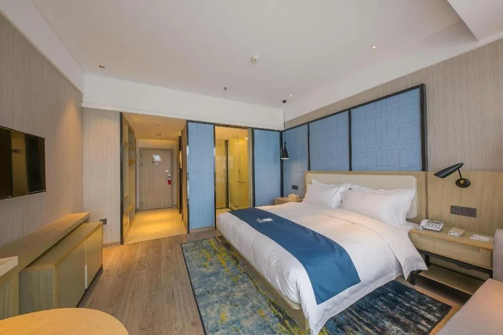 Bed in Echarm Hotel Xinyu Railway Station Baoshi Park