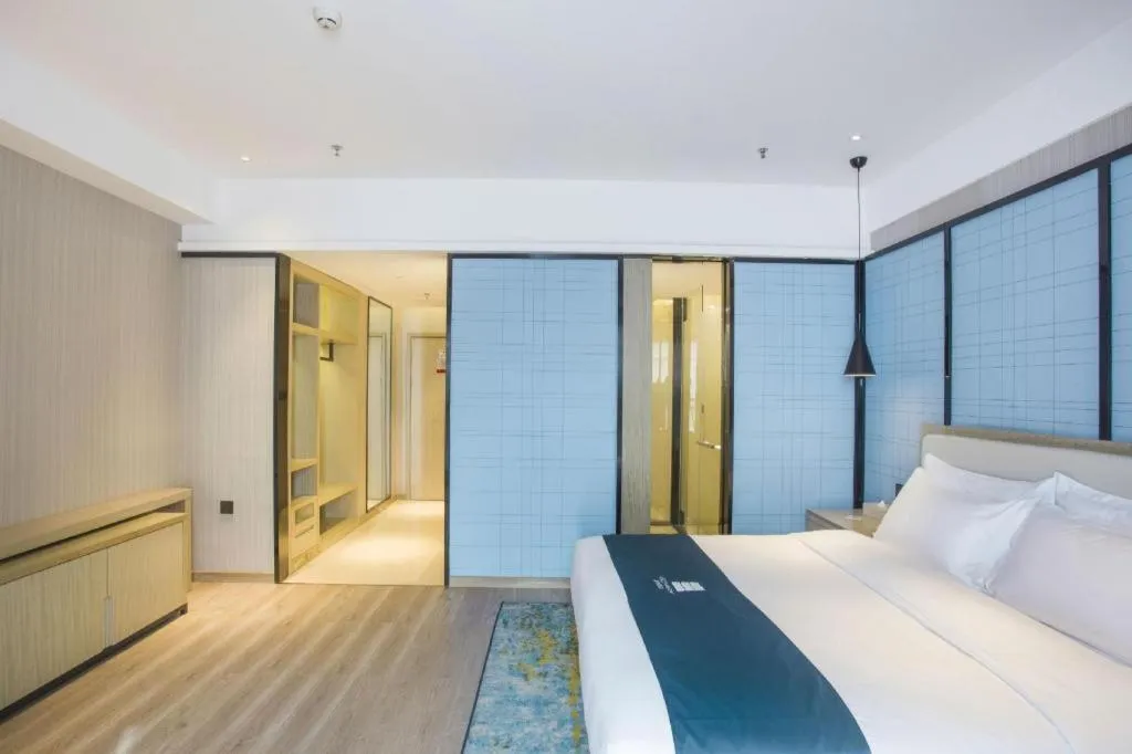 Bed in Echarm Hotel Xinyu Railway Station Baoshi Park