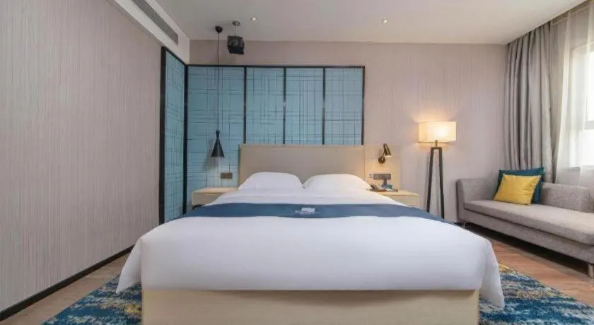Bed in Echarm Hotel Xinyu Railway Station Baoshi Park