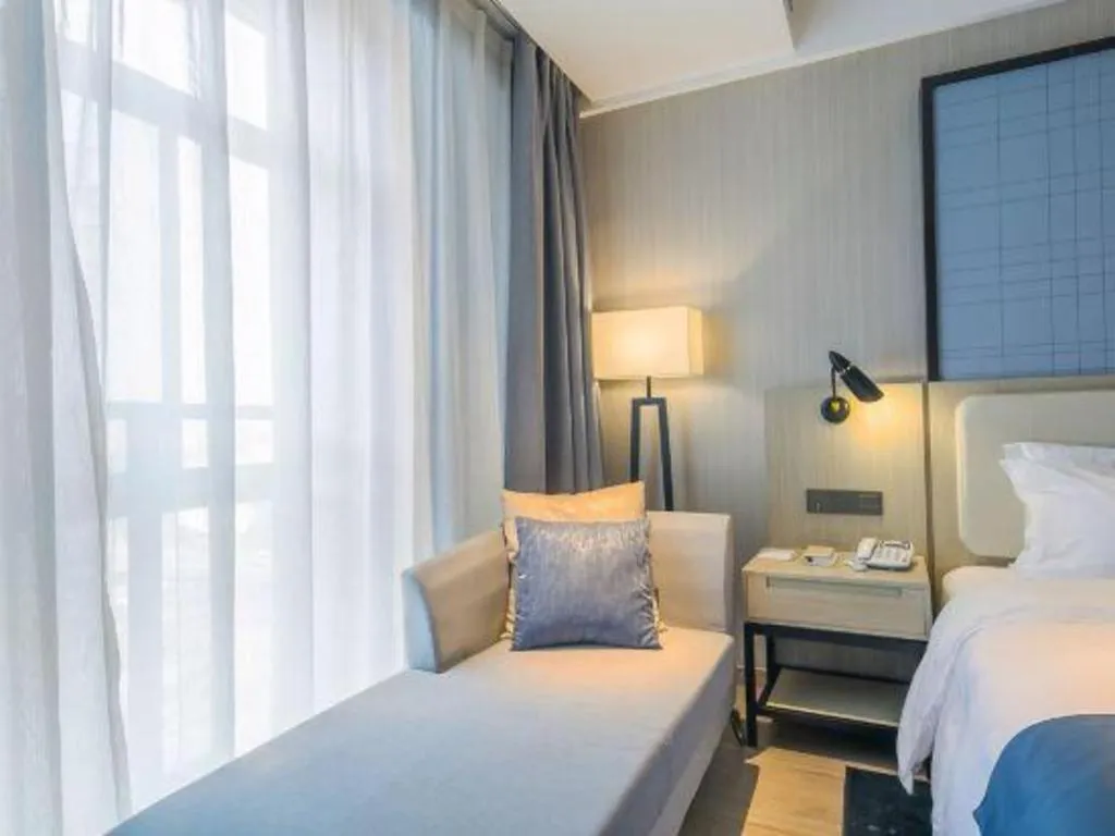 Bed in Echarm Hotel Xinyu Railway Station Baoshi Park