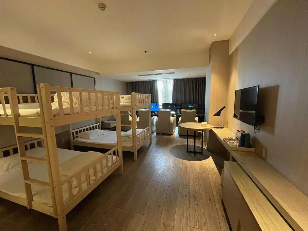 Bed in Echarm Hotel Xinyu Railway Station Baoshi Park