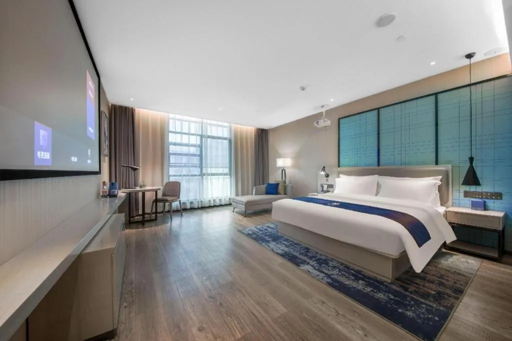 Bed in Echarm Hotel Xinyu Railway Station Baoshi Park