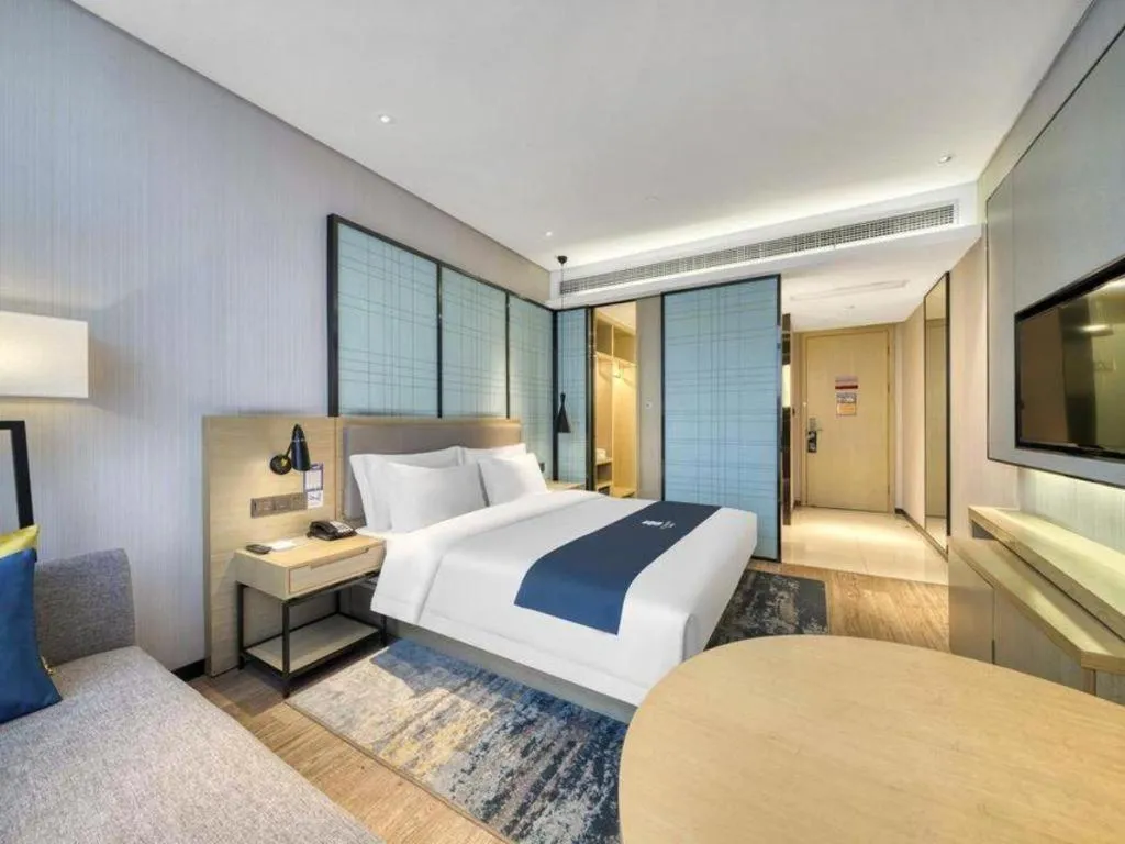 Bed in Echarm Hotel Nanjing Jiangning Tianyin Avenue Metro Station