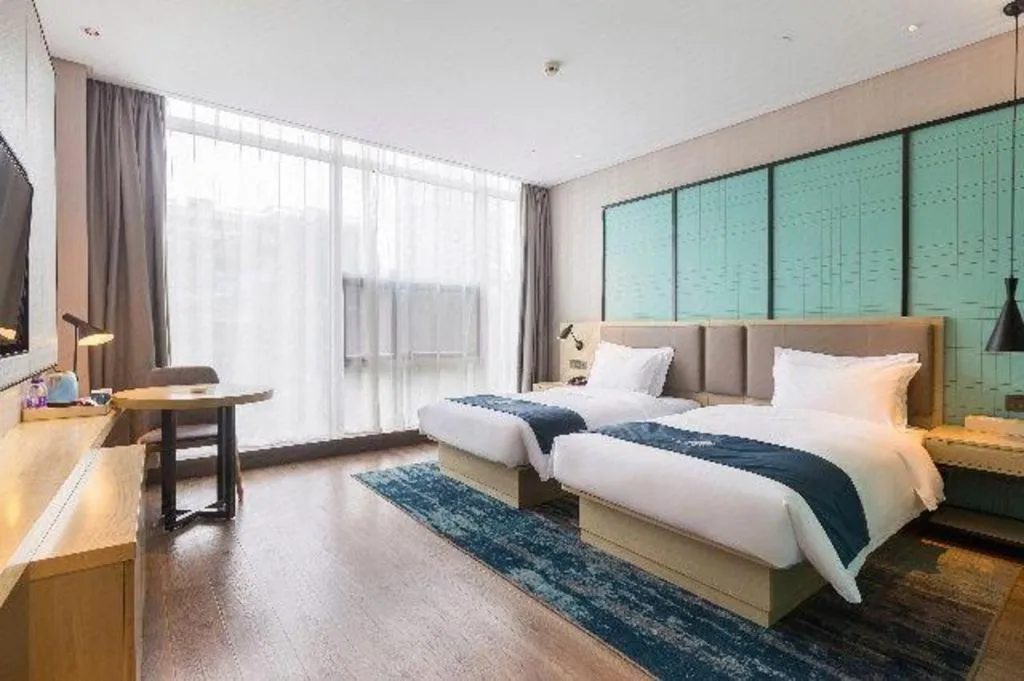 Bed in Echarm Hotel Nanjing Jiangning Tianyin Avenue Metro Station