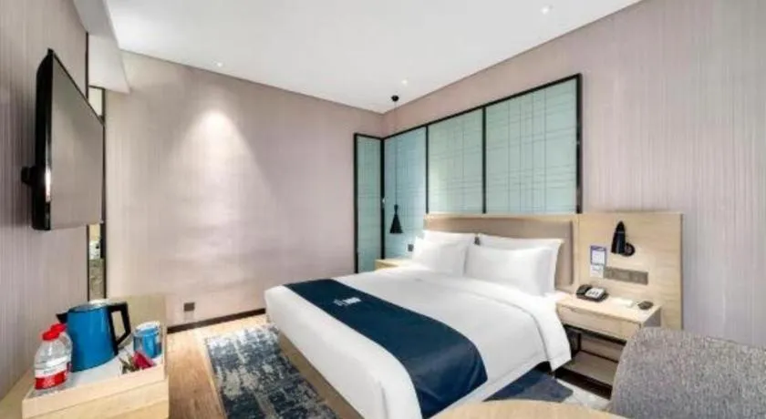 Bed in Echarm Hotel Nanjing Jiangning Tianyin Avenue Metro Station