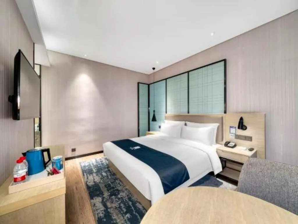 Bed in Echarm Hotel Nanjing Jiangning Tianyin Avenue Metro Station