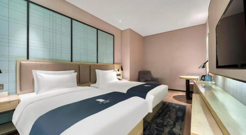 Bed in Echarm Hotel Nanjing Jiangning Tianyin Avenue Metro Station