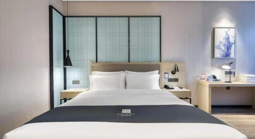 Bed in Echarm Hotel Nanjing Jiangning Tianyin Avenue Metro Station