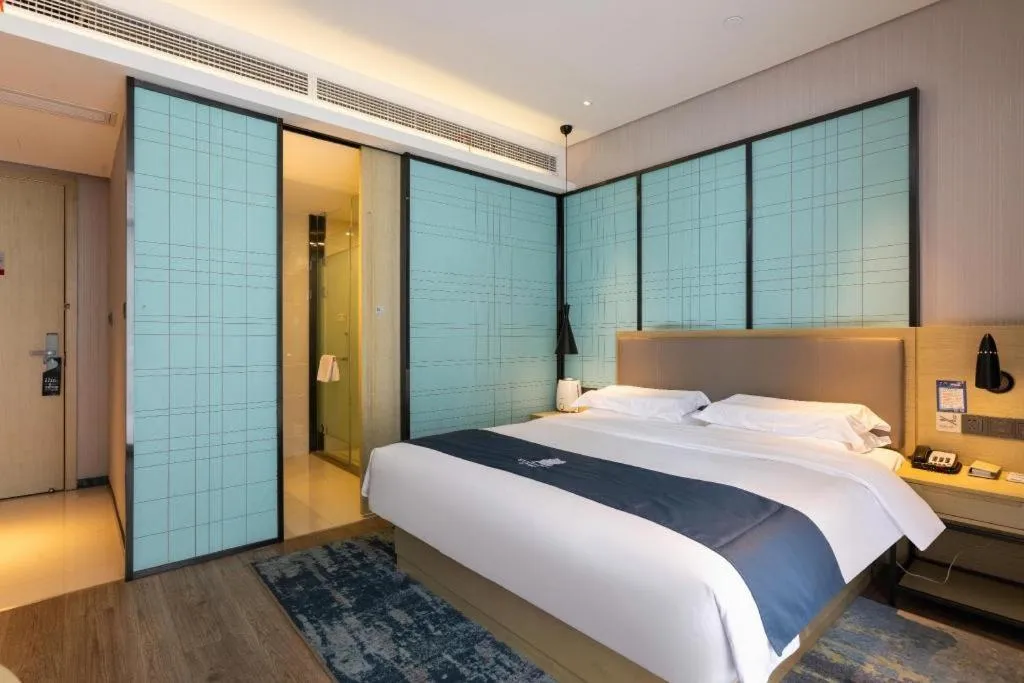 Bed in Echarm Hotel Nanjing Jiangning Tianyin Avenue Metro Station