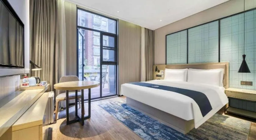 Bed in Echarm Hotel Nanjing Jiangning Tianyin Avenue Metro Station