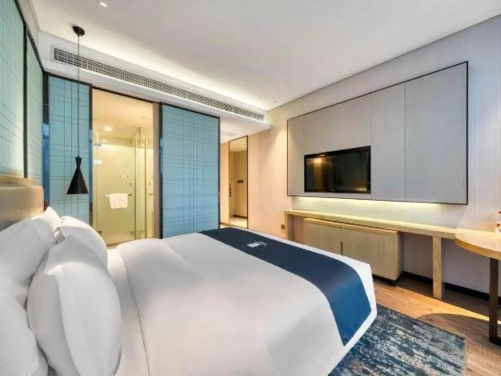 Bed in Echarm Hotel Nanjing Jiangning Tianyin Avenue Metro Station