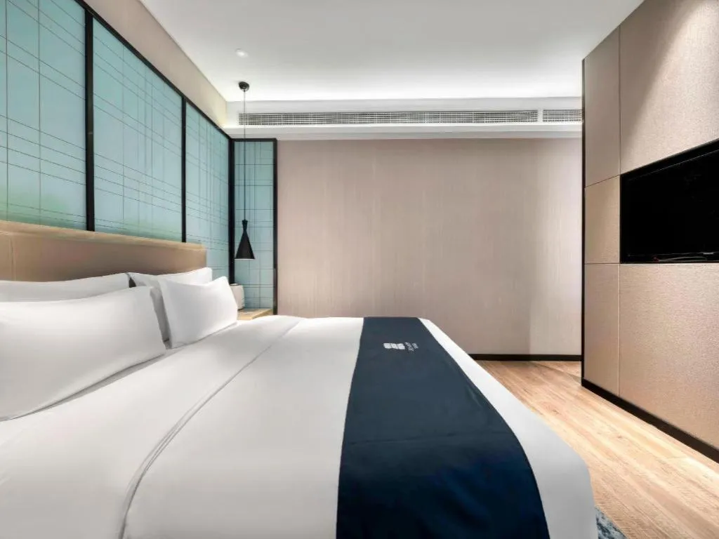 Bed in Echarm Hotel Nanjing Jiangning Tianyin Avenue Metro Station