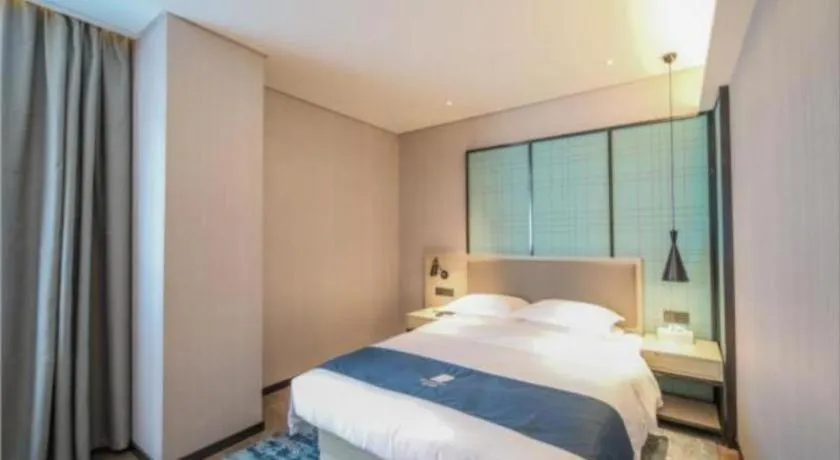 Bed in Echarm Hotel Nanjing Jiangning Tianyin Avenue Metro Station