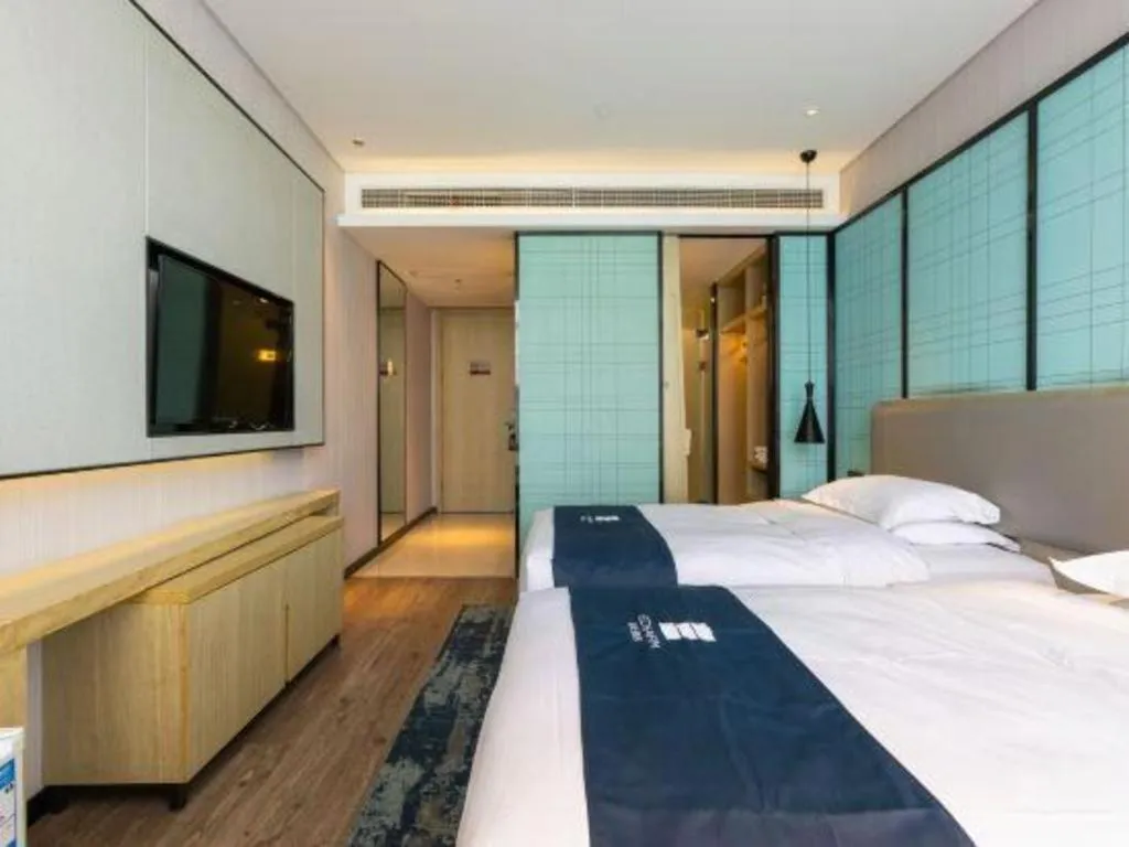 Bed in Echarm Hotel Nanjing Jiangning Tianyin Avenue Metro Station