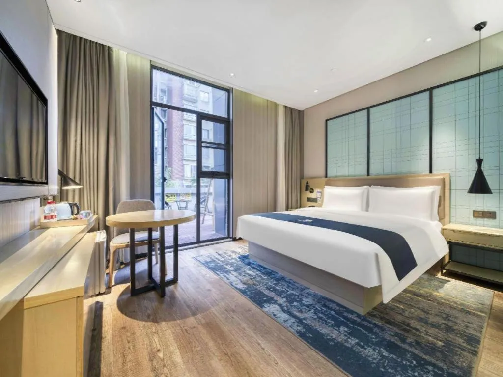 Bed in Echarm Hotel Nanjing Jiangning Tianyin Avenue Metro Station