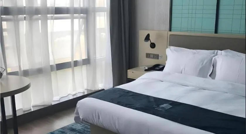 Bed in Echarm Hotel Nanjing Jiangning Tianyin Avenue Metro Station