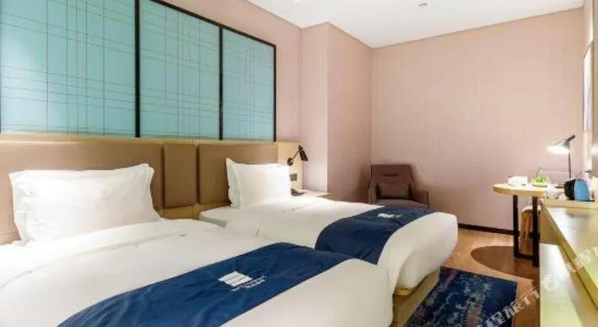 Bed in Echarm Hotel Nanjing Jiangning Tianyin Avenue Metro Station