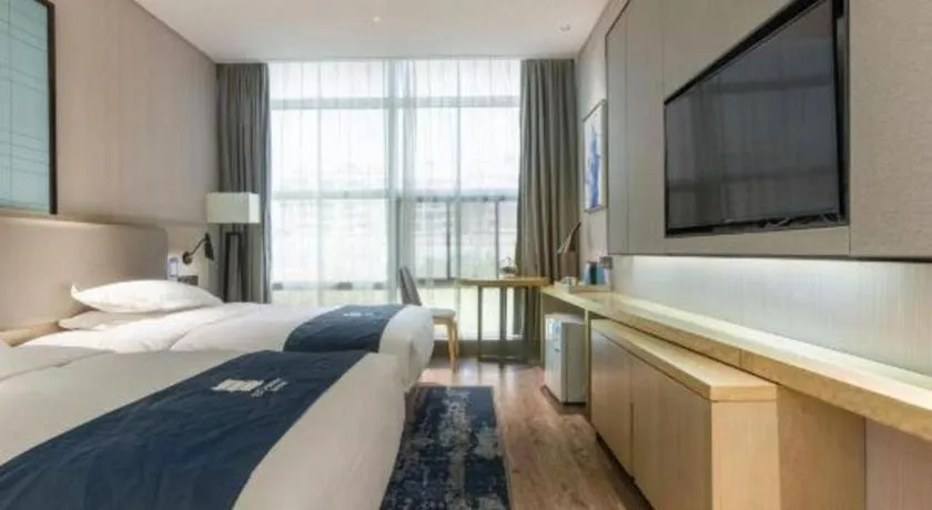 Bed in Echarm Hotel Nanjing Jiangning Tianyin Avenue Metro Station