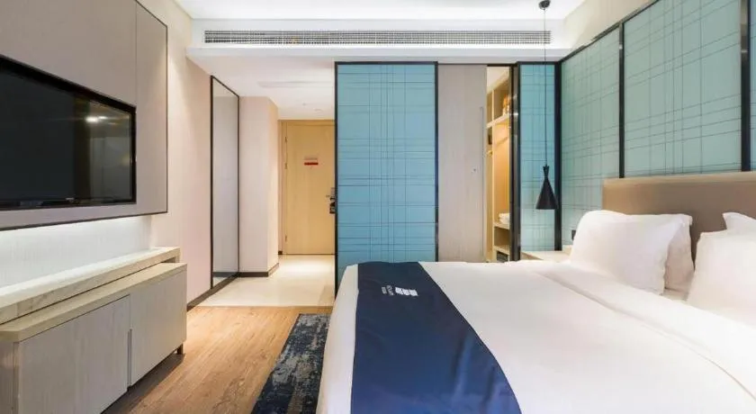 Bed in Echarm Hotel Nanjing Jiangning Tianyin Avenue Metro Station